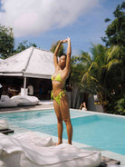 A Girl Wearing  Lime Green Zebra Print Jacquard Triangle Halter Bikini Set On Pool Side - OCEAN MYSTERY
