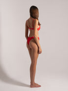 Ocean Mystery red thong bikini set with adjustable straps - minimalist swimwear design.