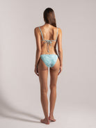 Model wearing sky blue ribbed bikini front side by Ocean Mystery Swimwear - sustainable textured fabric