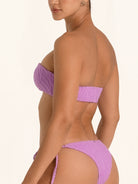 Back angle of purple bandeau bikini top with sleek textured finish.