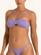 Back close up of purple bandeau bikini top with adjustable clasp closure.