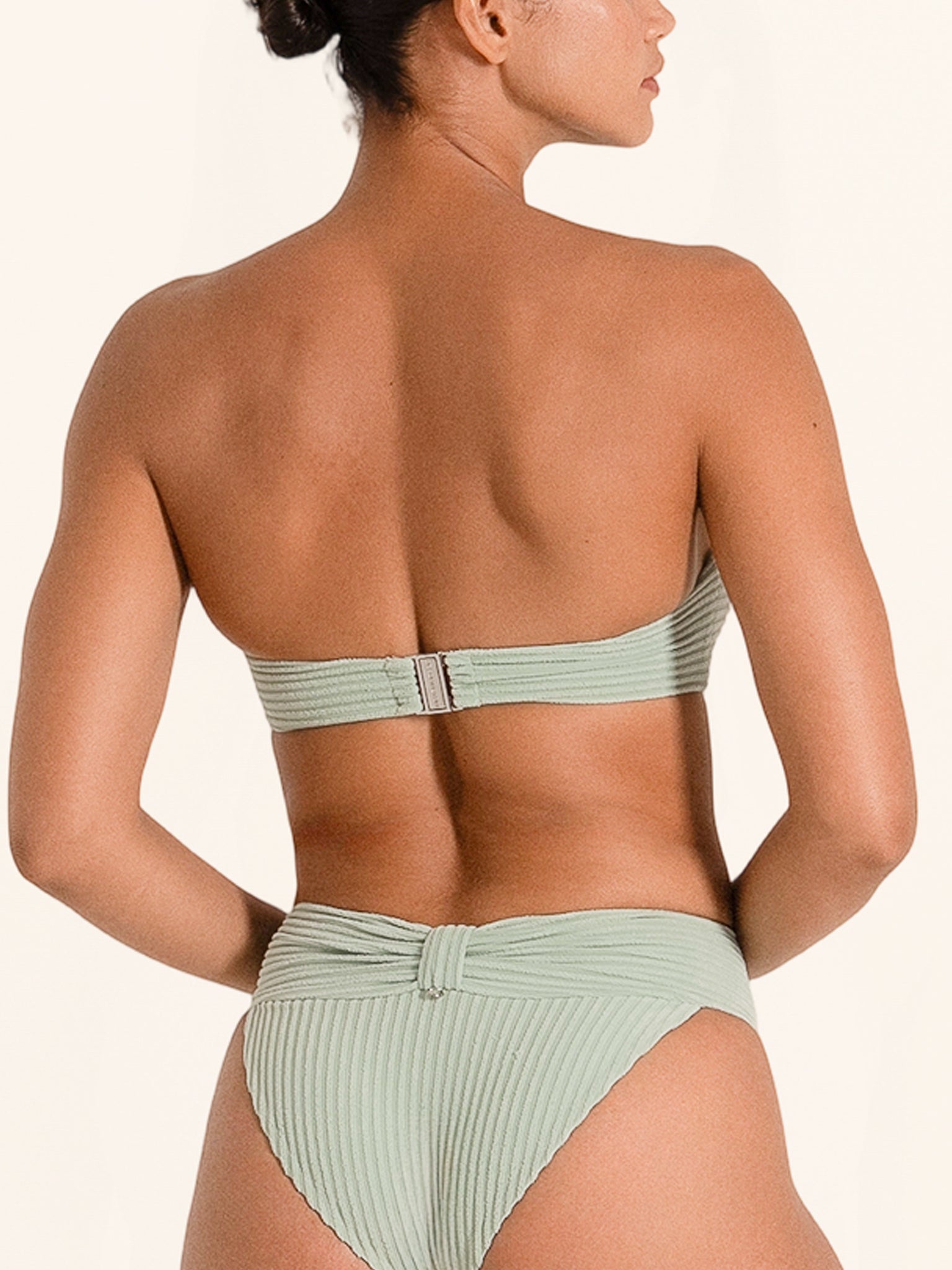 Green bandeau bikini top in strapless fit, perfect for beach days.