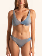 Front view of blue grey bikini bottom with textured fabric and high leg cut.