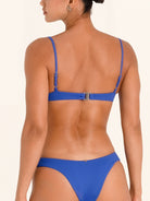 Blue scoop neck bikini top with back clasp closure.