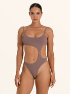 Brown asymmetrical cut out one piece swimsuit with ring detail.