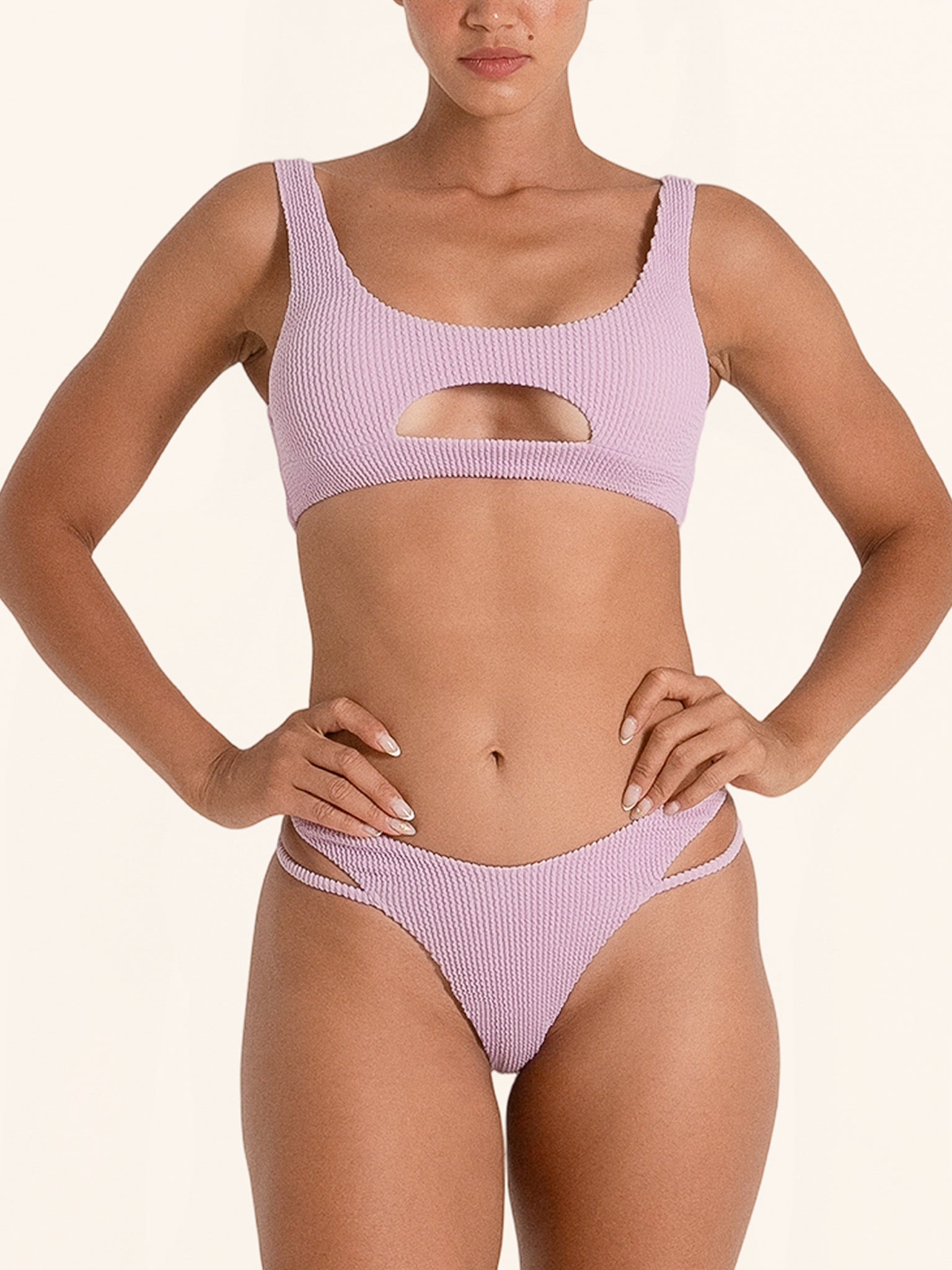 Chic lilac bikini bottom with trendy side cut design.