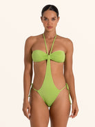 Green cut out one piece swimsuit featuring bandeau top and halter tie.