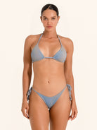 Denim blue swimwear triangle top with halter straps.