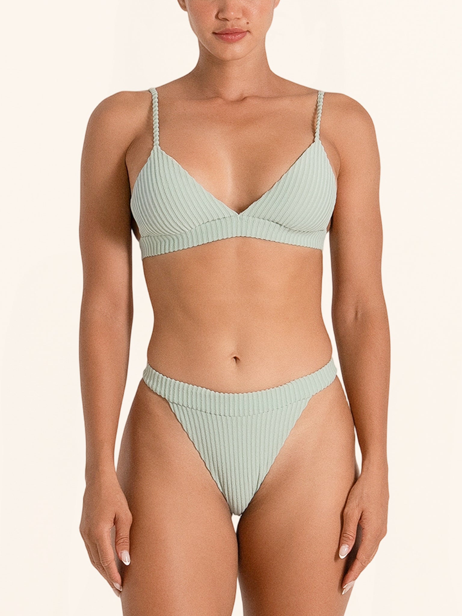 Mint green bikini bottom in high waist style for a chic beach look.
