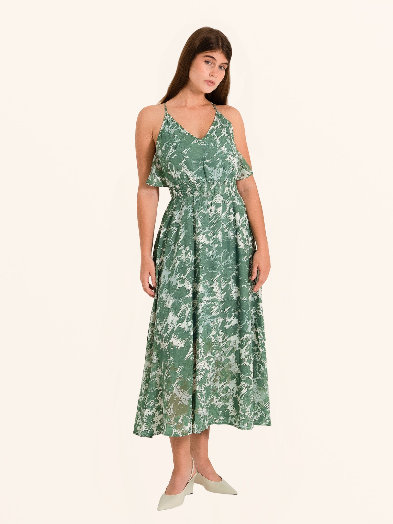 ull body front view of green floral maxi dress with flowing hemline