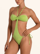 Green halter cut out one piece swimsuit with tie side bottom.