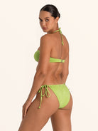 Green halter cutout one piece swimwear with open sides.