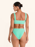 High cut bikini bottom in mint green with structured sides.
