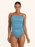 Light blue ruched one piece swimsuit with adjustable side ties.