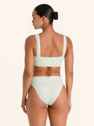 Light green high-rise textured bikini bottom for a chic beach look.