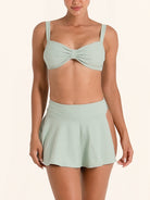 Light green swim skirt bikini bottom with ribbed texture.