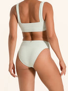 Light sage bikini bottom in a high-rise cut with textured detail.