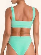 Supportive mint green bikini top with wide shoulder straps.