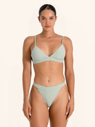 Mint green swimwear triangle top with minimalist design.
