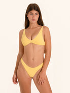 Mustard yellow bikini top with deep V neckline and slim straps.