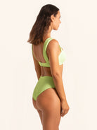 Trendy neon green high-waist bikini bottom with structured design.