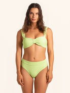 Front view of neon green thick strap bikini top with textured fabric.