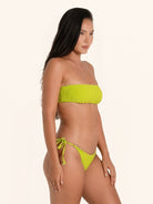 Neon green tube bikini top with minimal strap-free style.