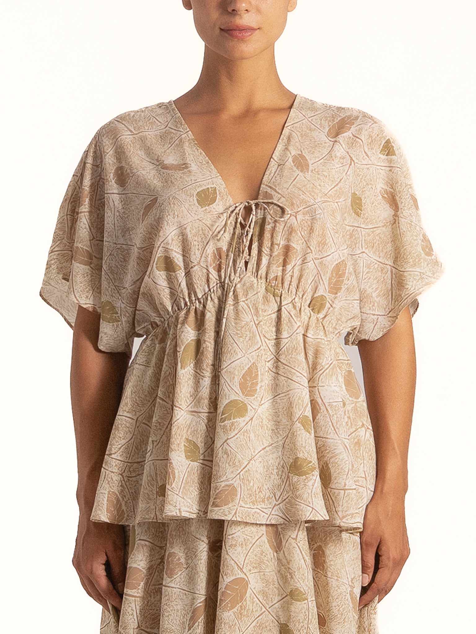 Ocean Mystery beige floral maxi dress featuring soft layered bodice and delicate print details.