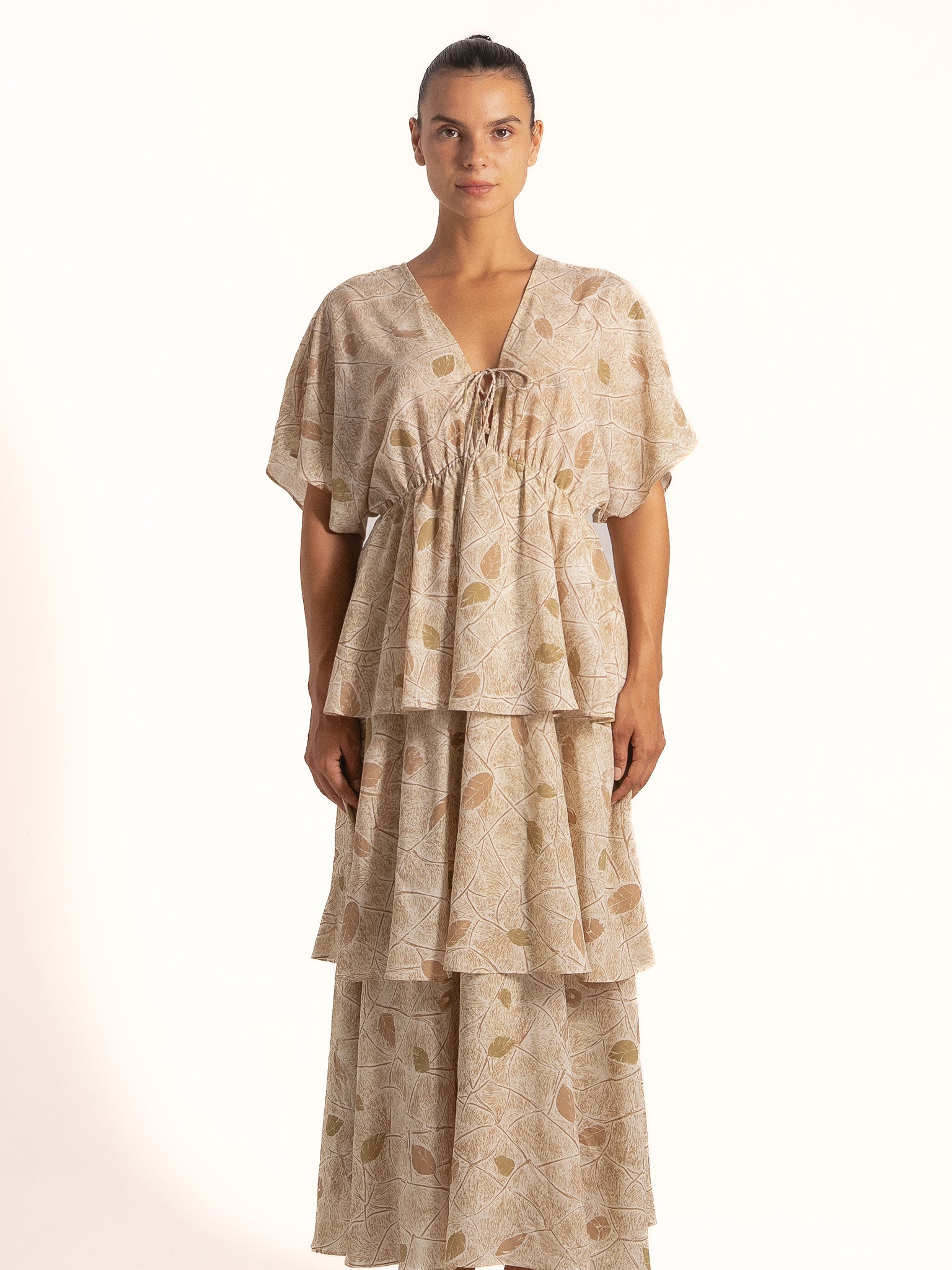 Ocean Mystery beige floral tiered maxi dress with V neckline and flutter sleeves, front look.