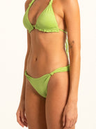 Model lifestyle shot in Ocean Mystery green bikini bottom