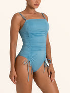 OCEAN MYSTERY light blue ruched one piece swimsuit with spaghetti straps.
