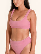 OCEAN MYSTERY pink bikini top featuring wide supportive straps and ribbed texture.