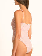 Back view of Ocean Mystery red gingham one piece swimsuit with scoop back and minimal coverage.