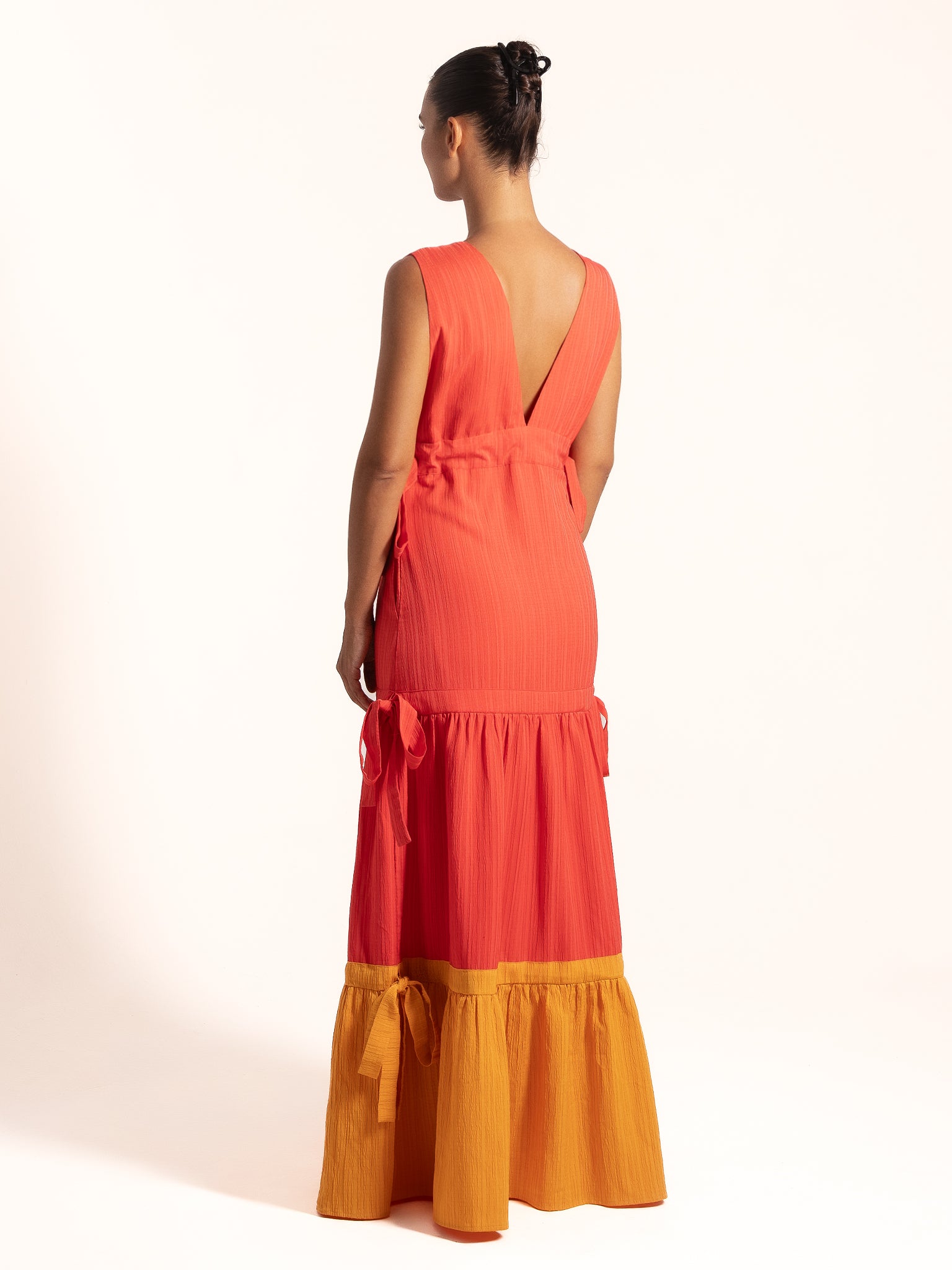 Ocean Mystery red and mustard yellow maxi dress with plunging V neckline and elegant summer silhouette.