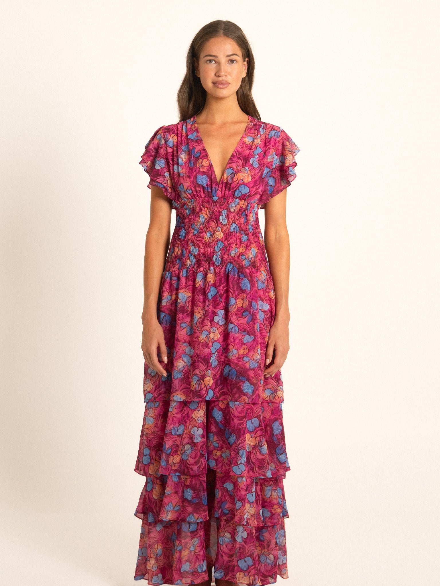 Ocean Mystery red and purple floral long dress with flutter sleeves and tiered ruffle skirt, perfect for resort wear.