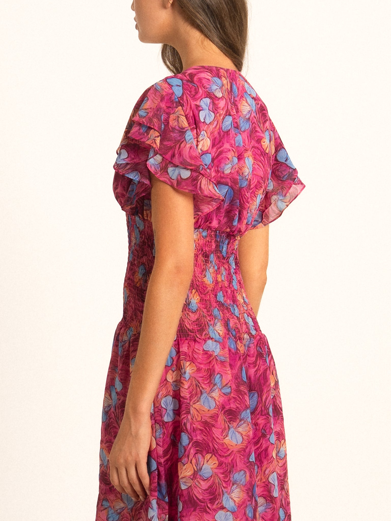 Back angle of Ocean Mystery red purple floral maxi dress featuring soft chiffon fabric and flowy silhouette.