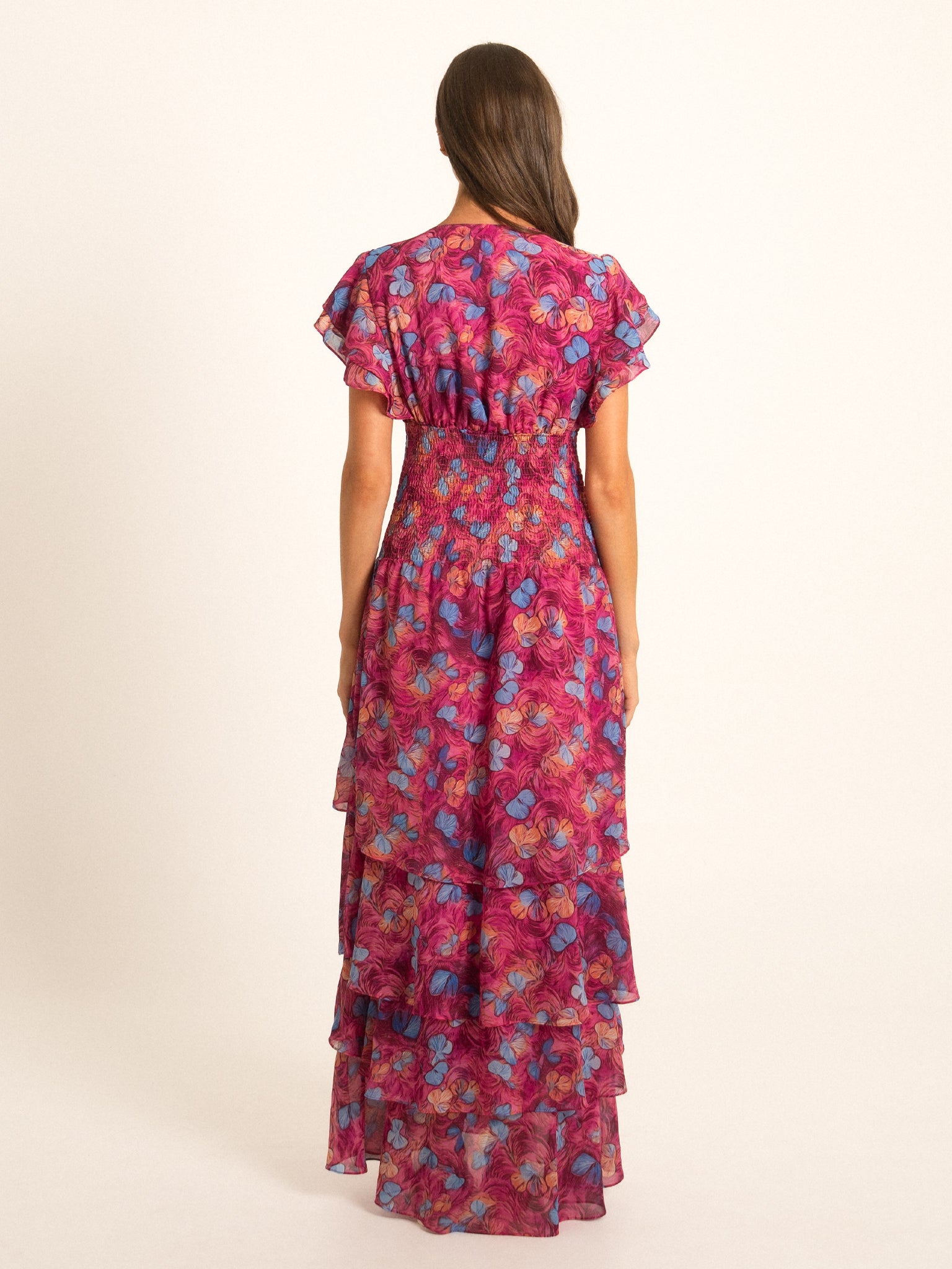 Back view of Ocean Mystery red and purple floral ruffle maxi dress with tiered layers and relaxed fit.