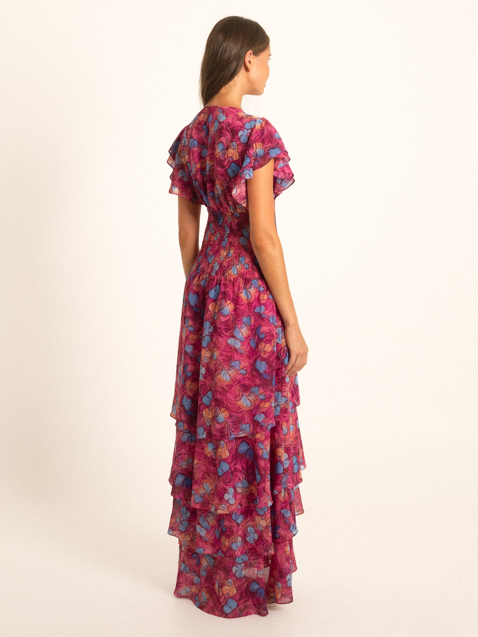 Front view of Ocean Mystery red and purple floral maxi dress with cascading ruffles and V neckline.