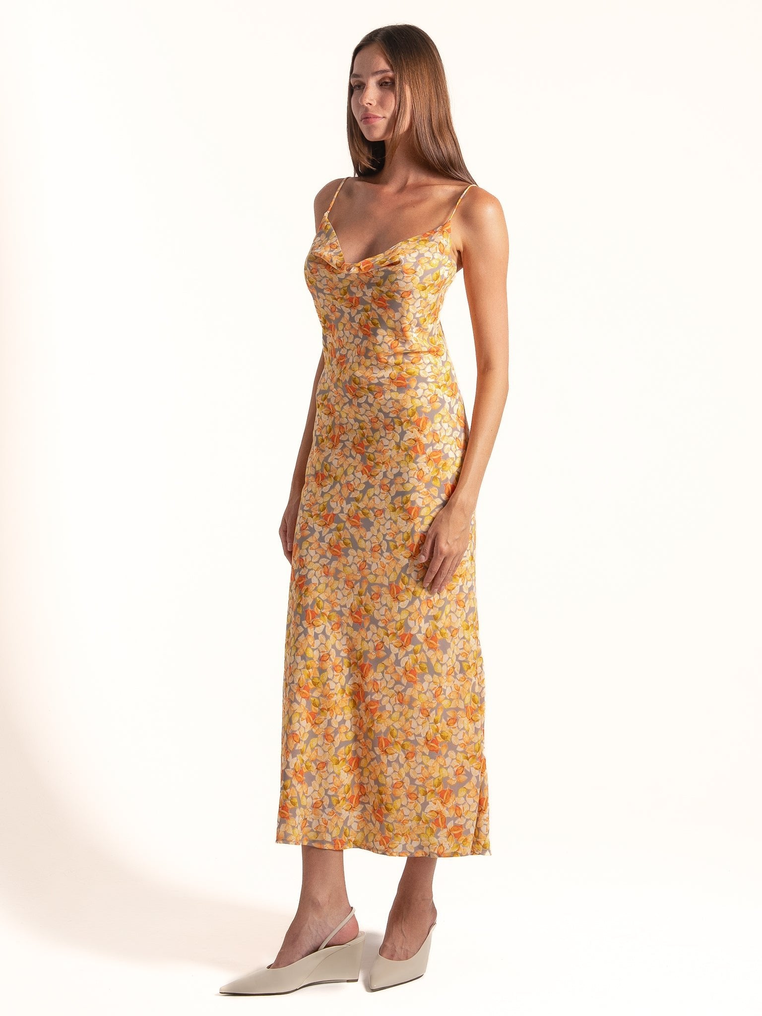 Full length view of Ocean Mystery yellow floral cowl neck midi dress designed for summer occasions.