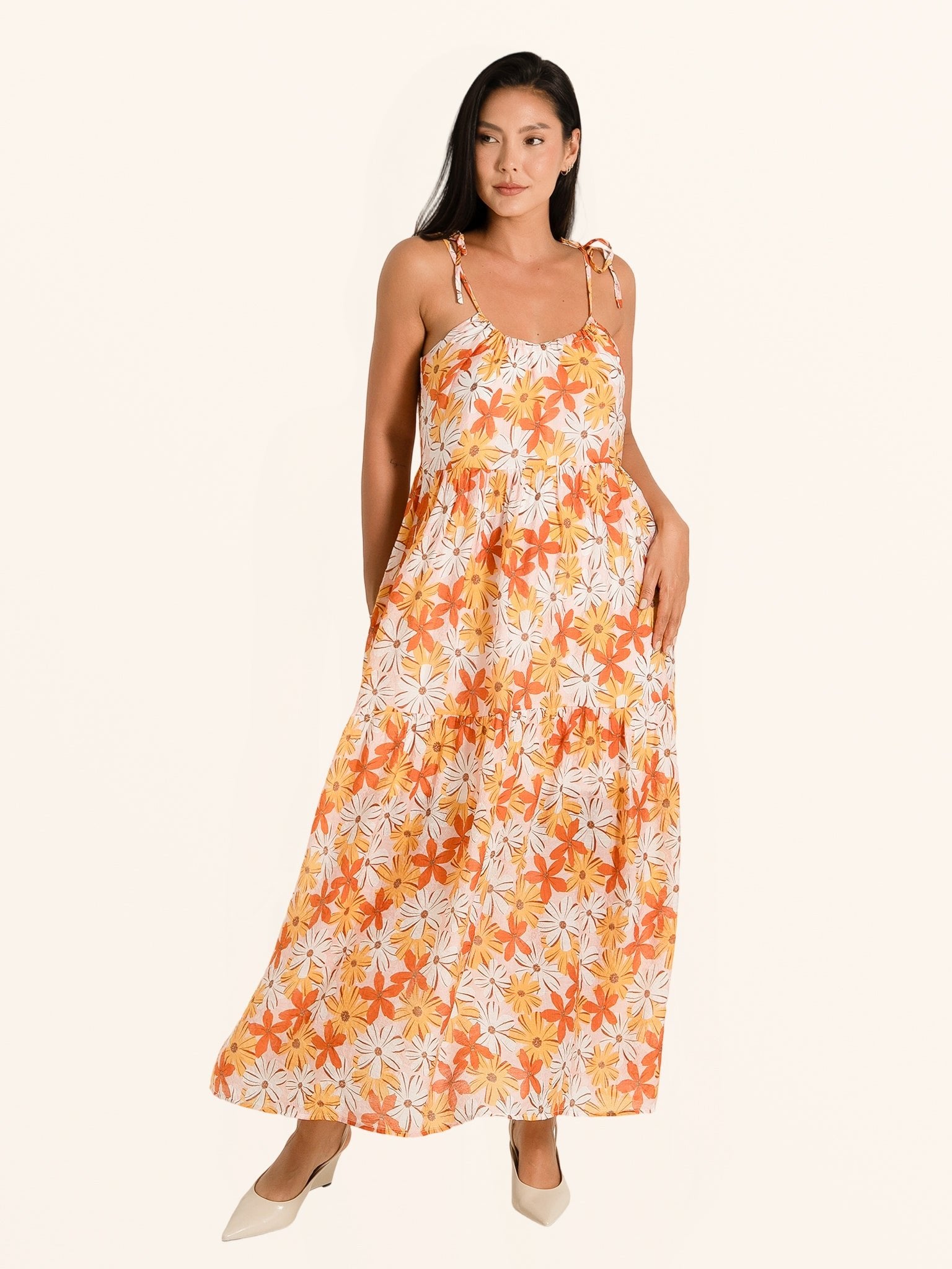 Full length front view of orange floral maxi dress with casual summer style