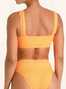Sporty orange bikini top with square shape and ribbed fabric.