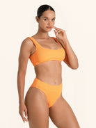 Orange bikini top with square neckline and wide shoulder straps.