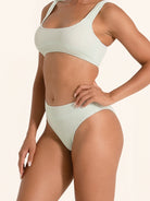 Pale green high-waisted swimwear bottom offering a sculpted fit.