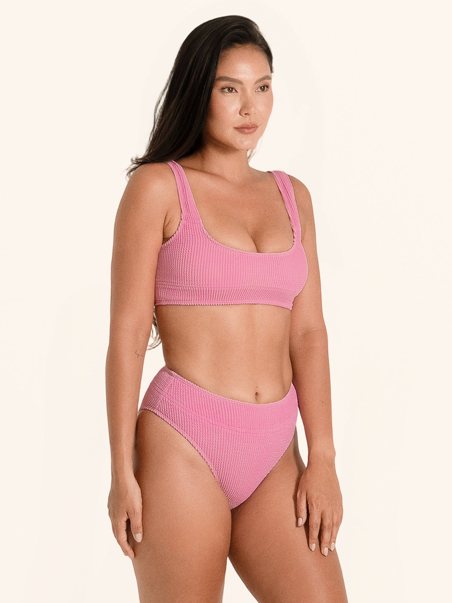 Pink thick strap bikini top with textured fabric and square back design.