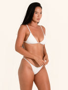 Plain white swimwear top in triangle cut with thin straps.