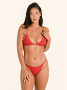 Red bikini top featuring slim adjustable shoulder straps.