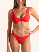 Front view of red bikini bottom in high-rise style with flattering fit.