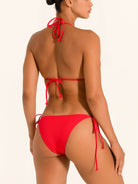 Back view of red triangle bikini top with halter tie closure and open back design.
