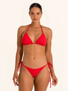 Front view of red triangle bikini top with halter tie straps and classic triangle cups.