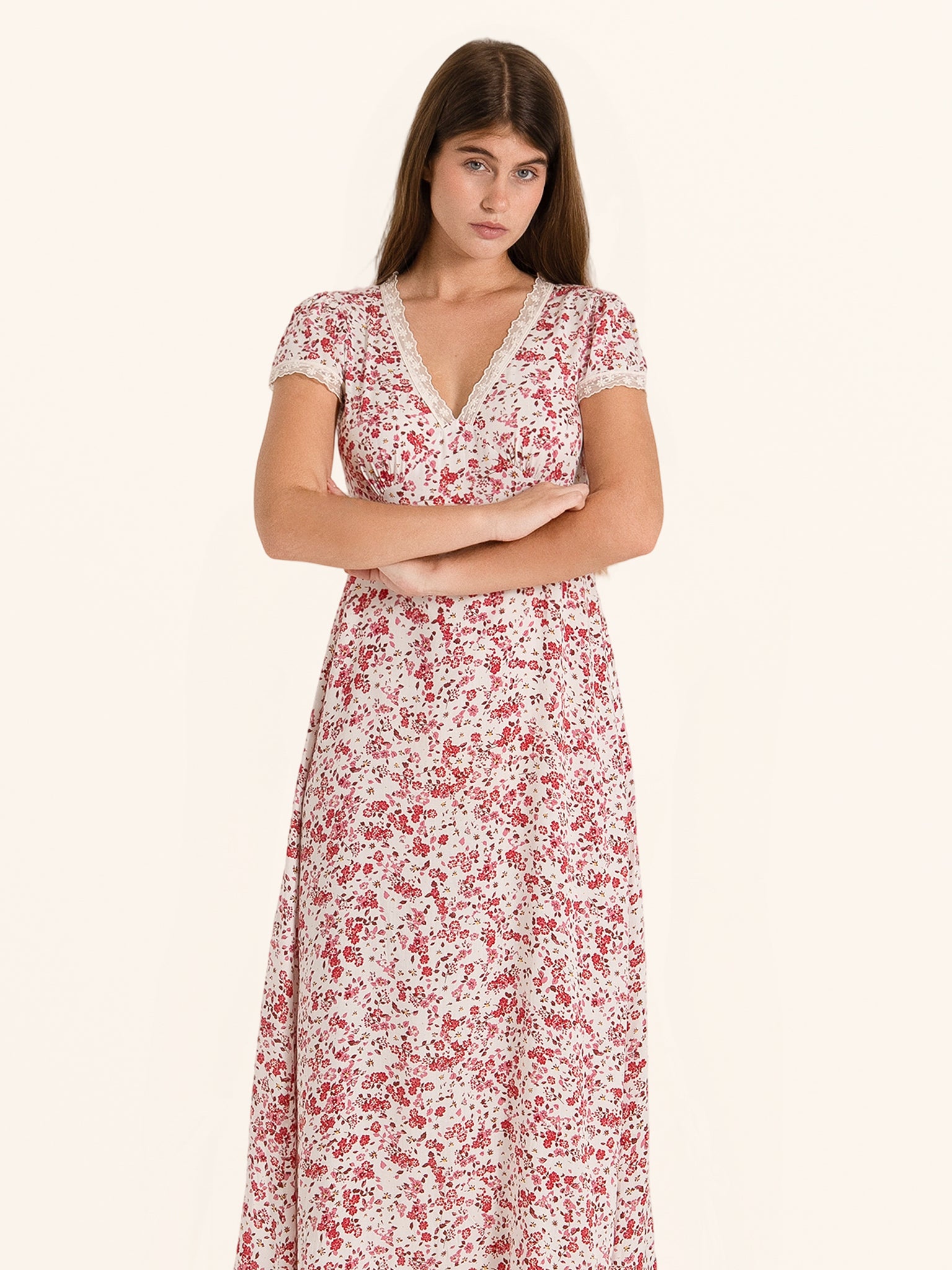 Front view of red and white floral midi dress with V neckline and short sleeves